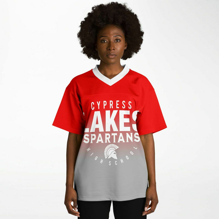 Black woman wearing Cypress Lakes Spartans football Jersey