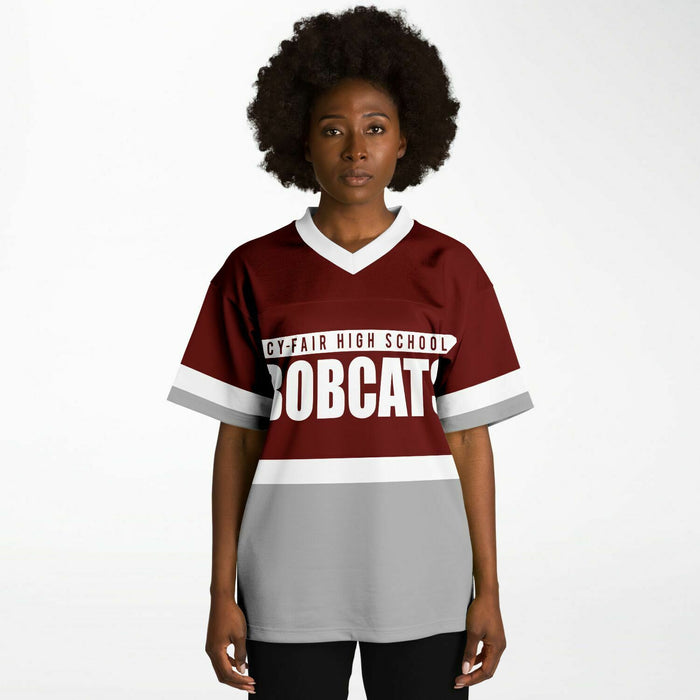 Black woman wearing Cy-Fair Bobcats football Jersey