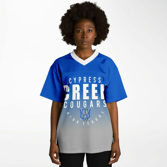 Black woman wearing Cypress Creek Cougars football Jersey