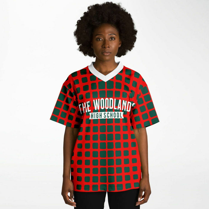 Black woman wearing The Woodlands Highlanders High School football Jersey