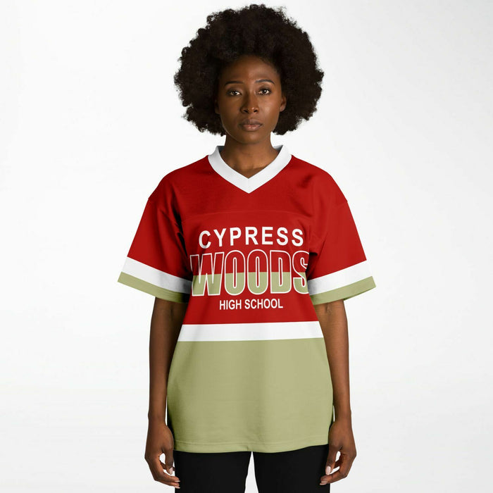 Black woman wearing Cypress Woods Wildcats football Jersey 10