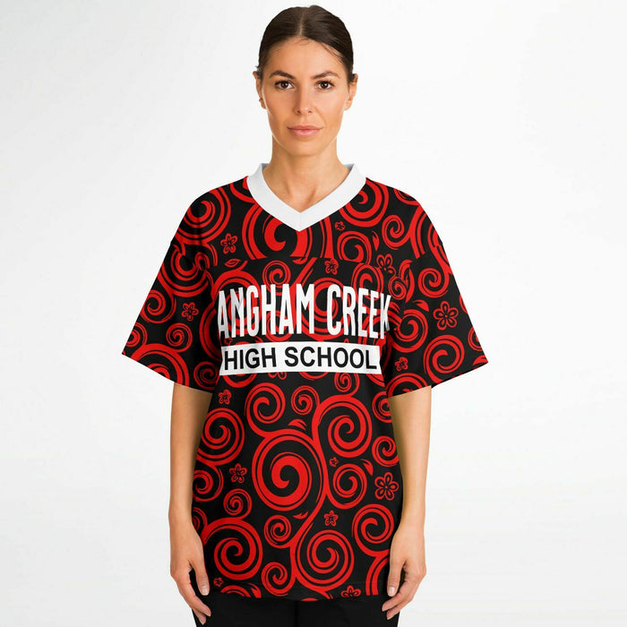 Women wearing Langham Creek Lobos football jersey