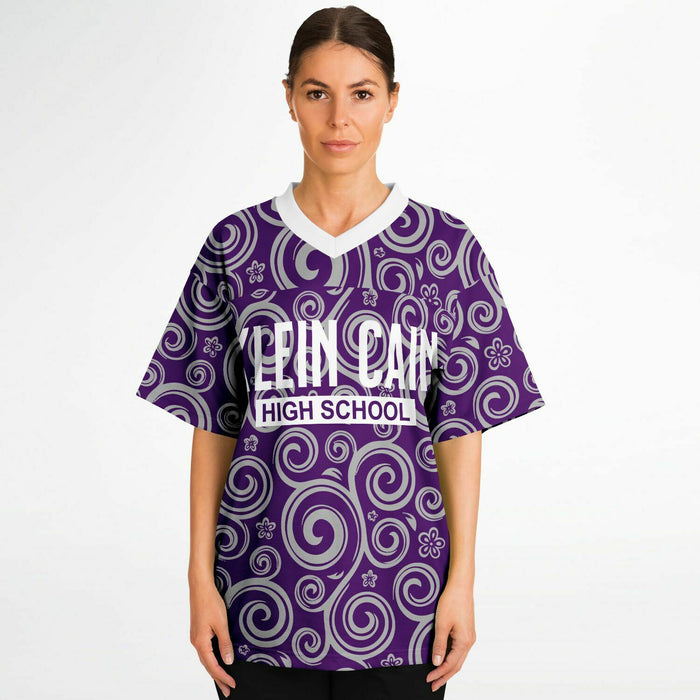 Women wearing Klein Cain Hurricanes football jersey