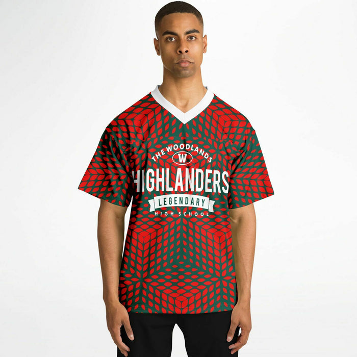 Black man wearing The Woodlands Highlanders High School football Jersey