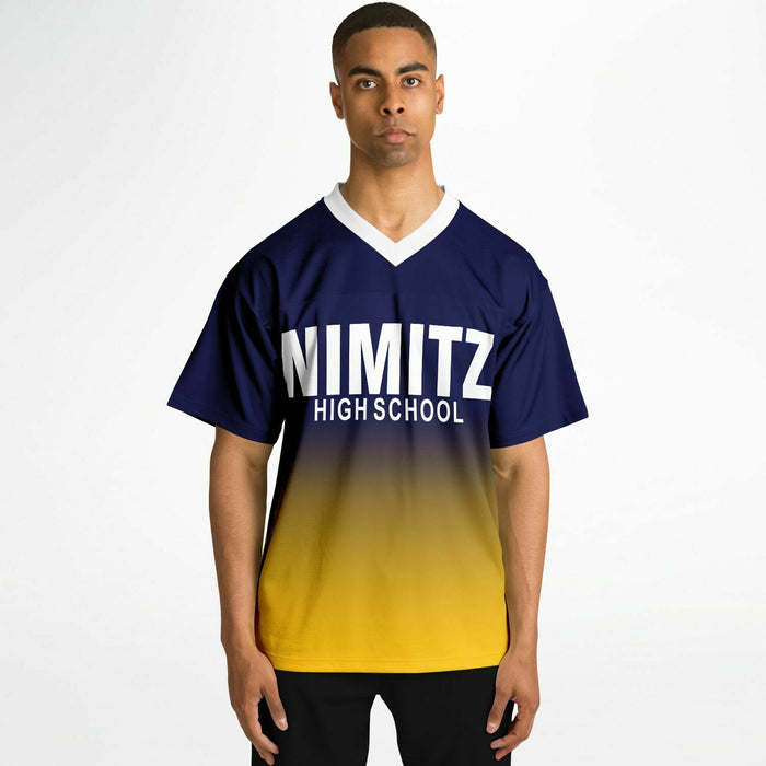 Black man wearing Nimitz Cougars High School football Jersey