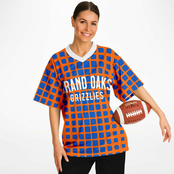 Woman wearing Grand Oaks Grizzlies football jersey