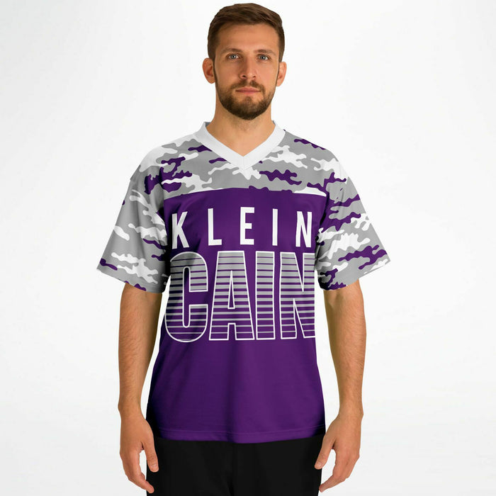 Man wearing Klein Cain Hurricanes football jersey