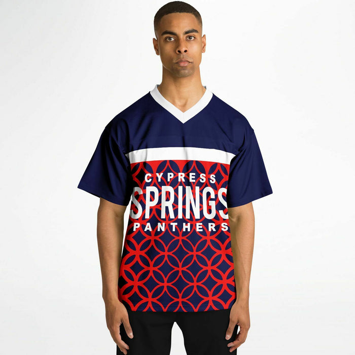 Black man wearing Cypress Springs Panthers football Jersey