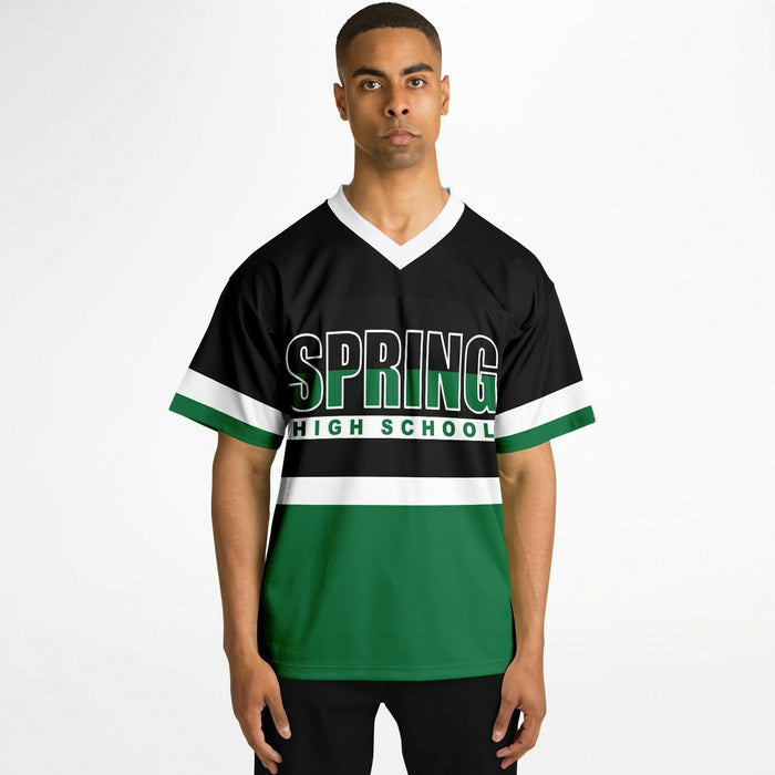 Black man wearing Spring Lions High School football Jersey