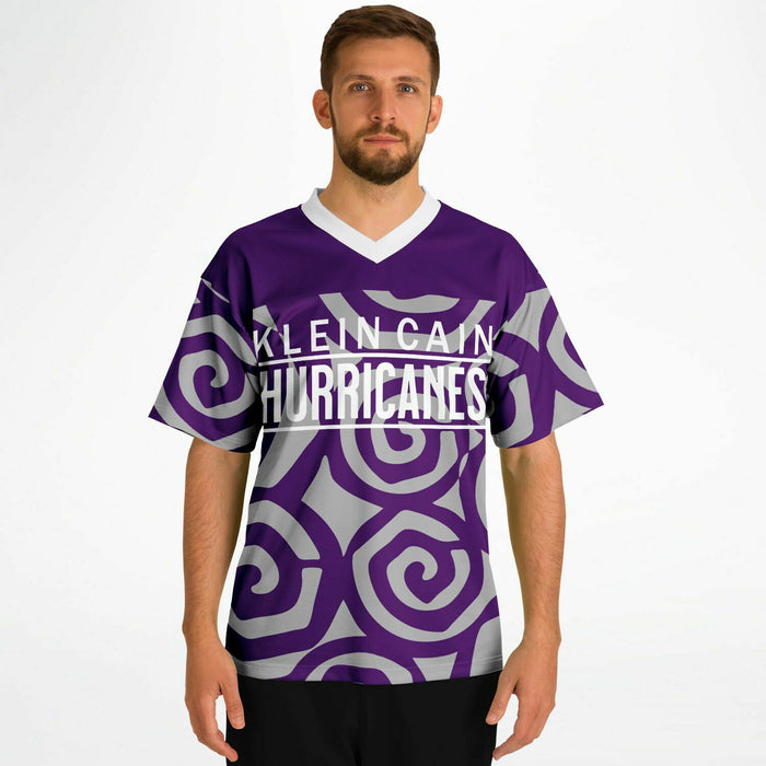 Man wearing Klein Cain Hurricanes football jersey