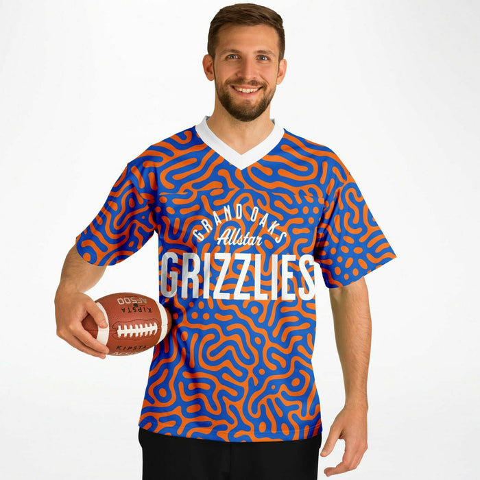 Black man wearing Grand Oaks Grizzlies football Jersey