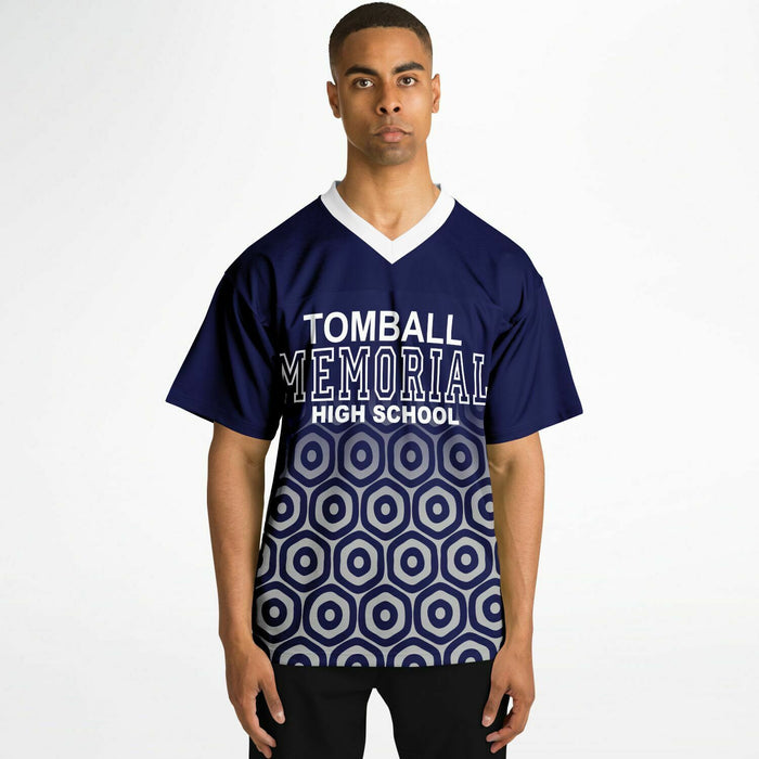 Black man wearing Tomball Memorial Wildcats High School football Jersey