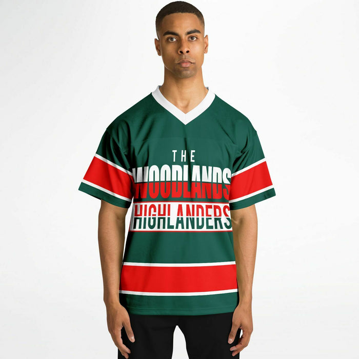 Black man wearing The Woodlands Highlanders High School football Jersey