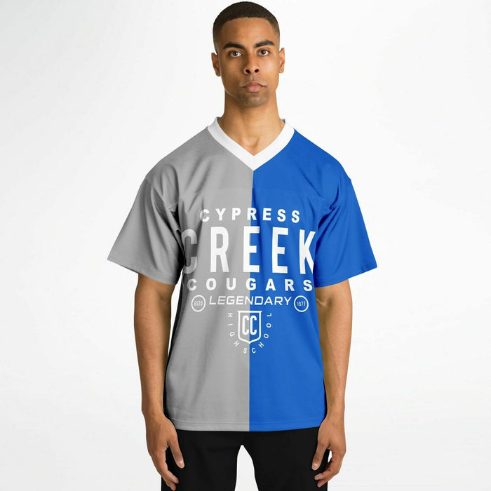 Black man wearing Cypress Creek Cougars football Jersey