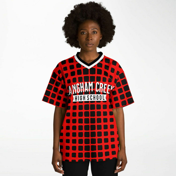 Black woman wearing Langham Creek Lobos football Jersey