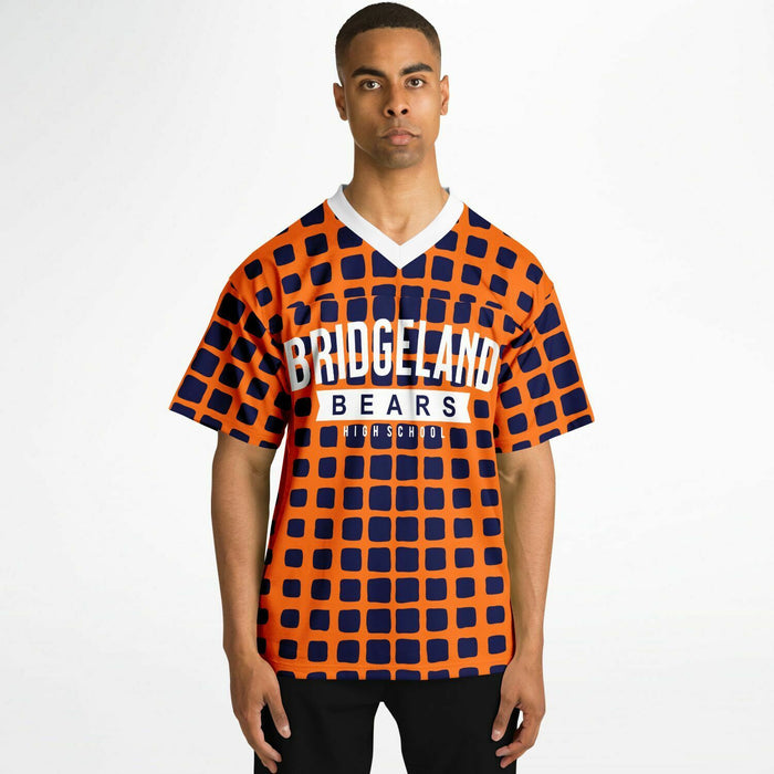 Black man wearing Bridgeland Bears football Jersey