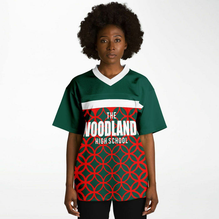 Black woman wearing The Woodlands Highlanders High School football Jersey