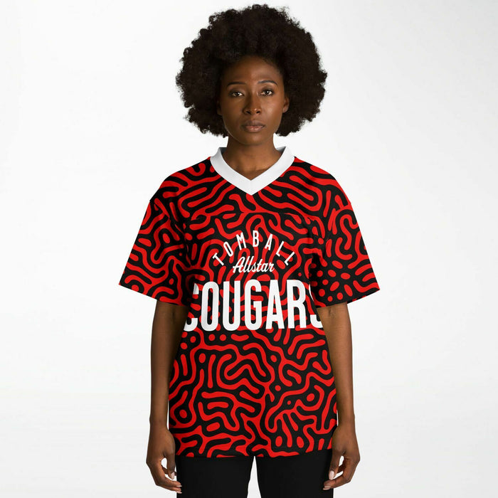 Black woman wearing Tomball Cougars High School football Jersey