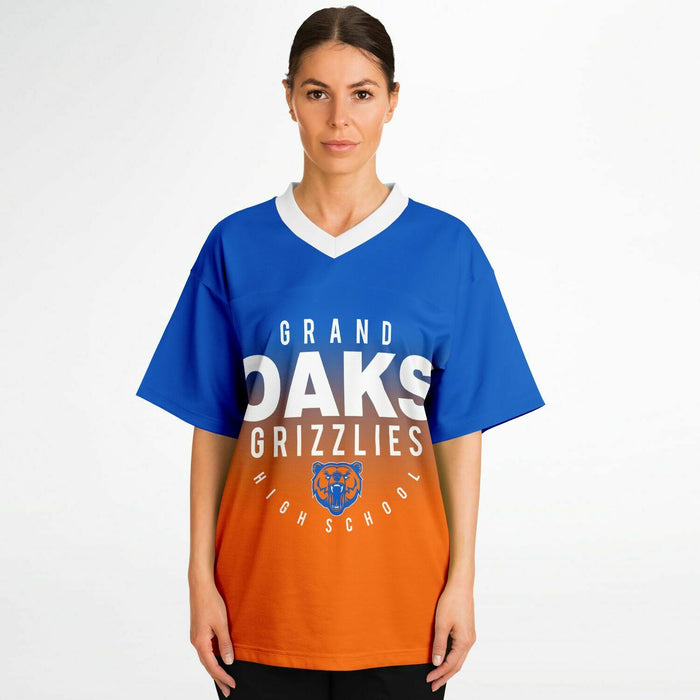 Women wearing Grand Oaks Grizzlies football jersey