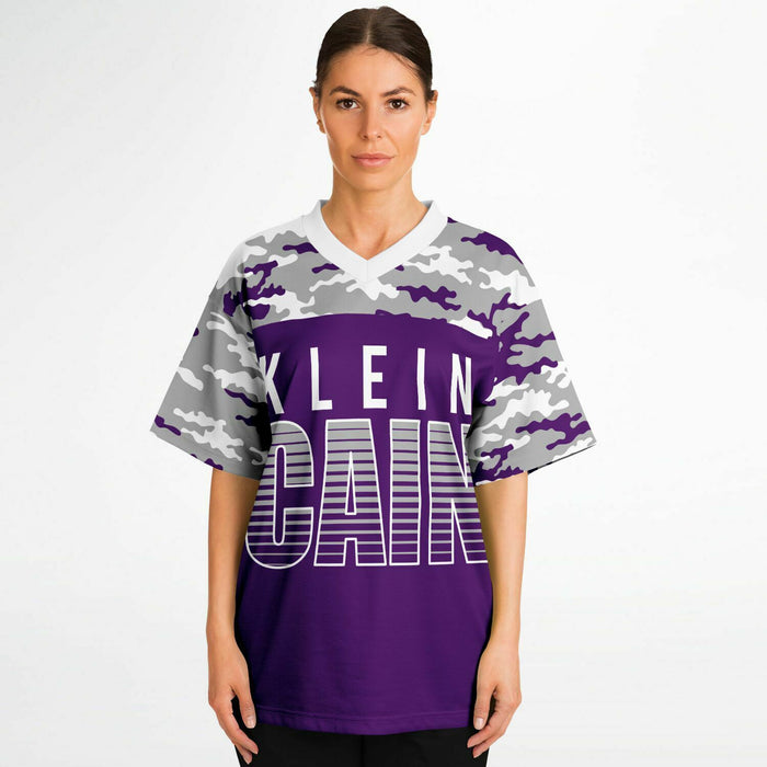 Women wearing Klein Cain Hurricanes football jersey