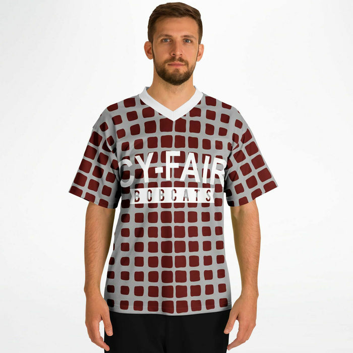 Man wearing Cy-Fair Bobcats football jersey