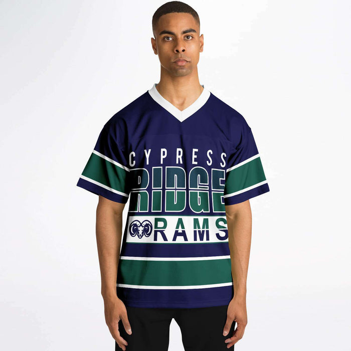 Black man wearing Cypress Ridge Rams football Jersey