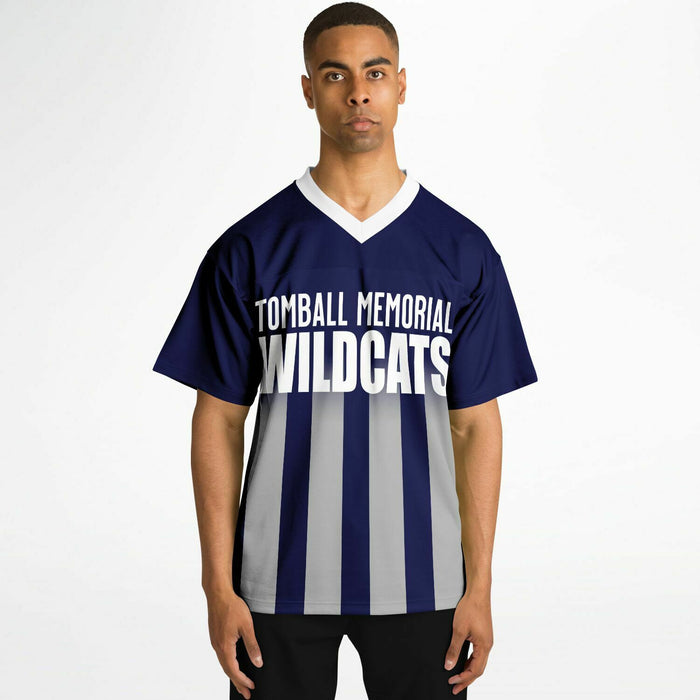 Black man wearing Tomball Memorial Wildcats High School football Jersey