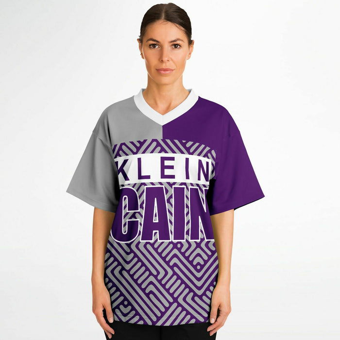 Women wearing Klein Cain Hurricanes football jersey