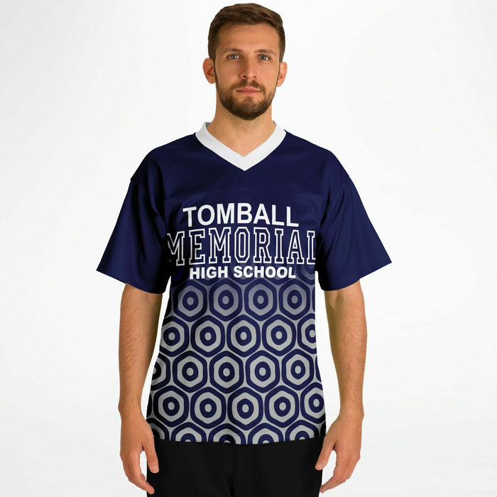 Man wearing Tomball Memorial Wildcats High School football jersey