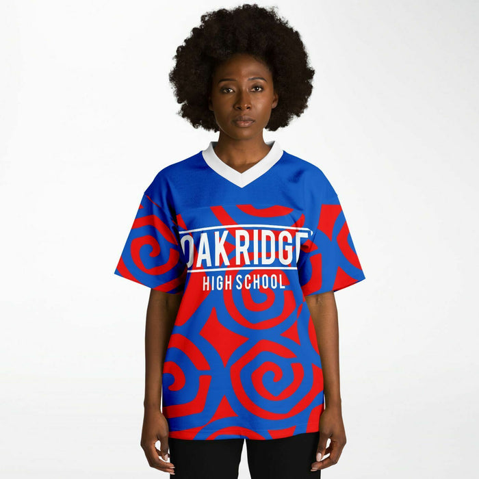 Black woman wearing Oak Ridge War Eagles High School football Jersey