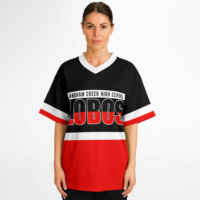 Women wearing Langham Creek Lobos football jersey