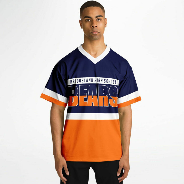 Black man wearing Bridgeland Bears football Jersey