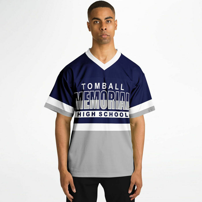 Black man wearing Tomball Memorial Wildcats High School football Jersey