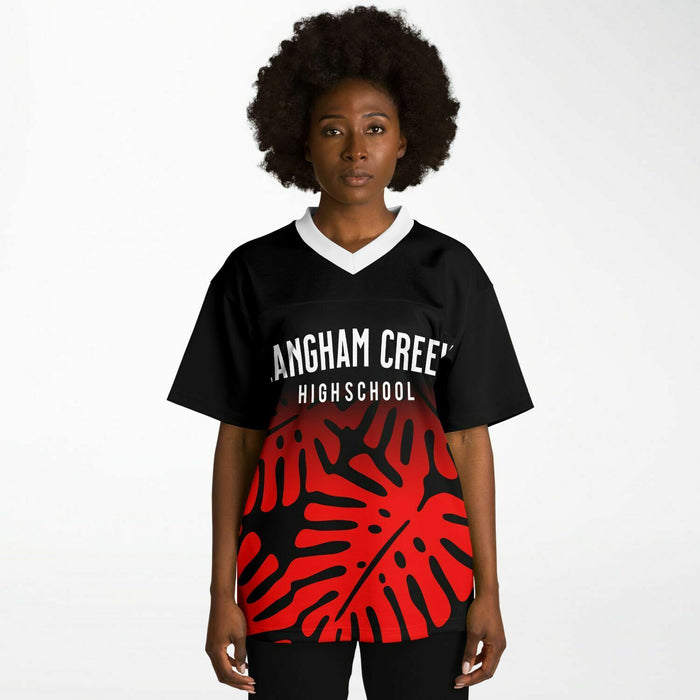 Black woman wearing Langham Creek Lobos football Jersey