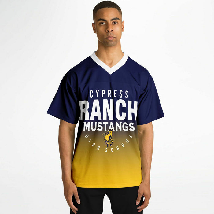Black man wearing Cypress Ranch Mustangs football Jersey