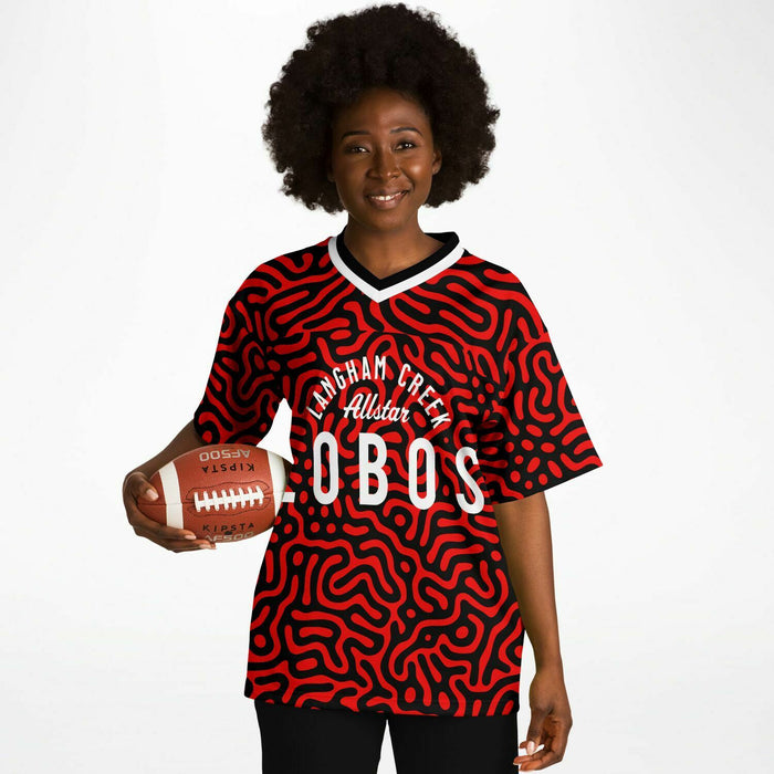 Women wearing Langham Creek Lobos football jersey