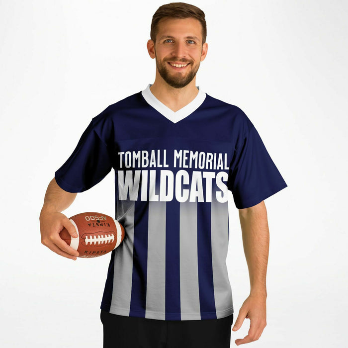 Man wearing Tomball Memorial Wildcats High School football jersey