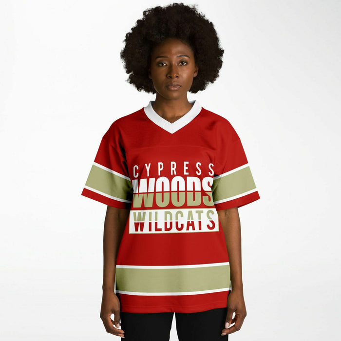 Black woman wearing Cypress Woods Wildcats football Jersey 13