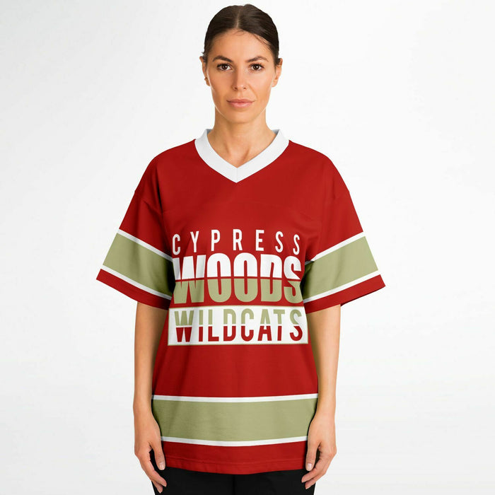 Women wearing Cypress Woods Wildcats football jersey 13