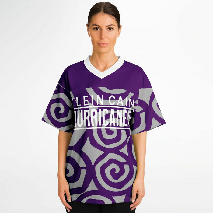 Women wearing Klein Cain Hurricanes football jersey