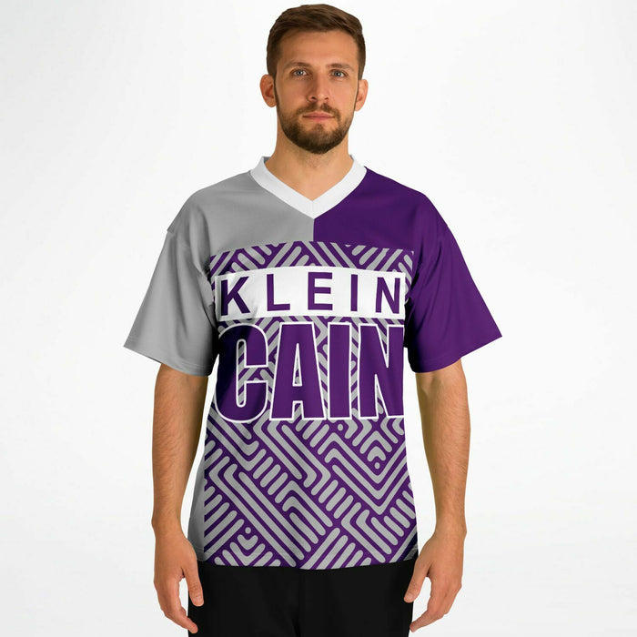 Man wearing Klein Cain Hurricanes football jersey