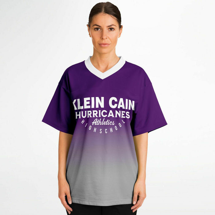 Women wearing Klein Cain Hurricanes football jersey