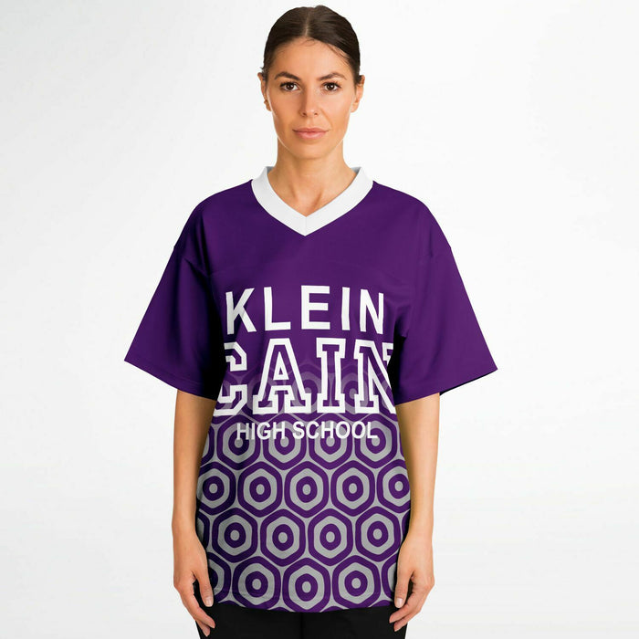 Women wearing Klein Cain Hurricanes football jersey