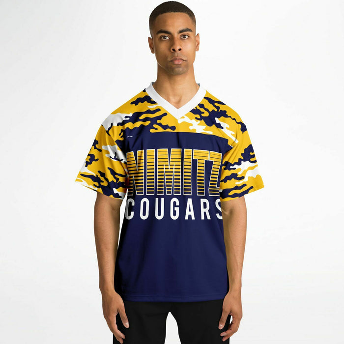 Black man wearing Nimitz Cougars High School football Jersey