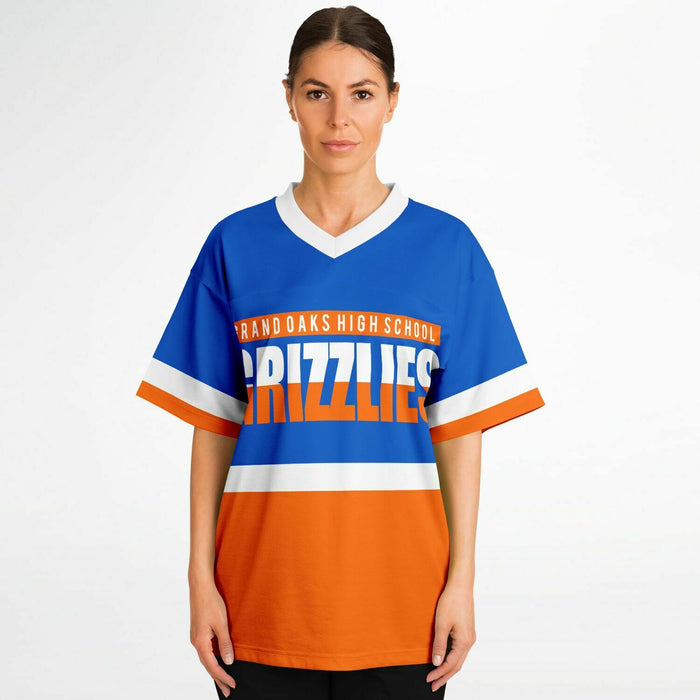 Women wearing Grand Oaks Grizzlies football jersey