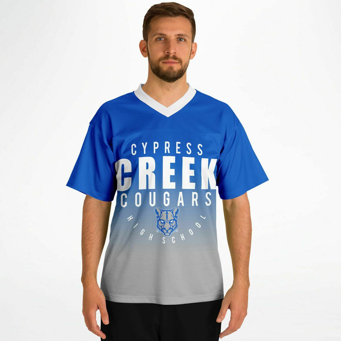 Man wearing Cypress Creek Cougars football jersey