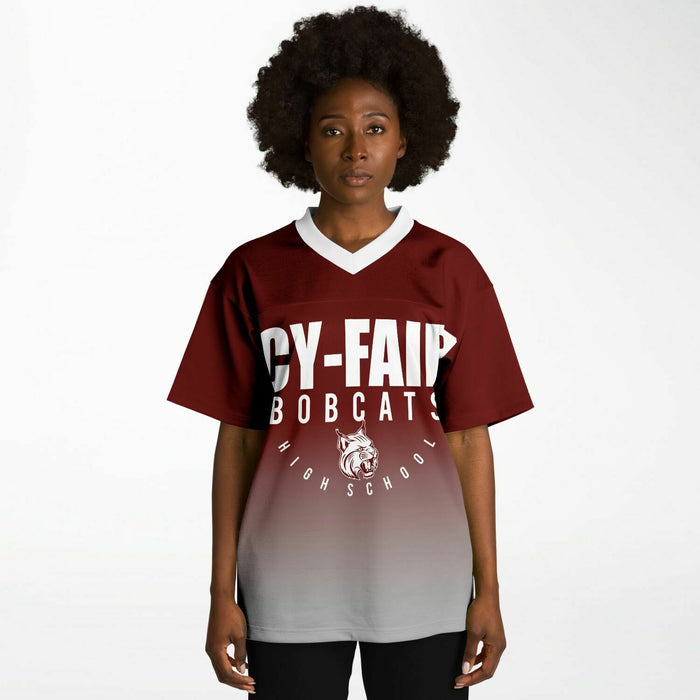 Black woman wearing Cy-Fair Bobcats football Jersey