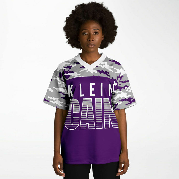 Black woman wearing Klein Cain Hurricanes football Jersey