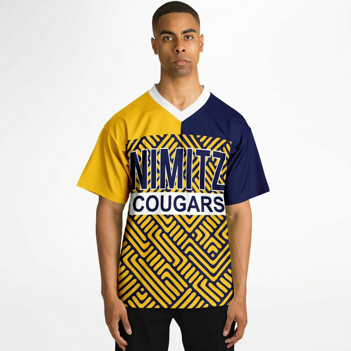 Black man wearing Nimitz Cougars High School football Jersey
