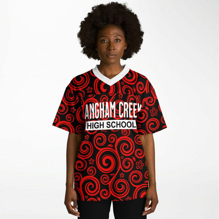 Black woman wearing Langham Creek Lobos football Jersey